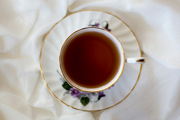 a cup of tea on a white cloth