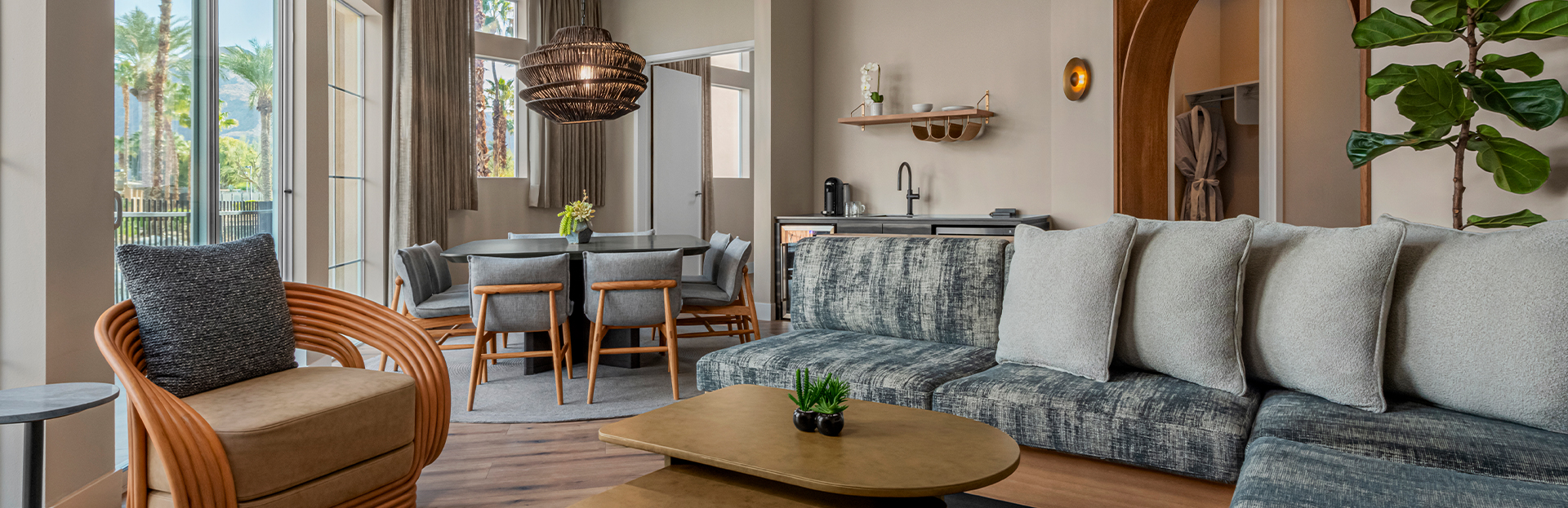 a living room with a couch and dining table