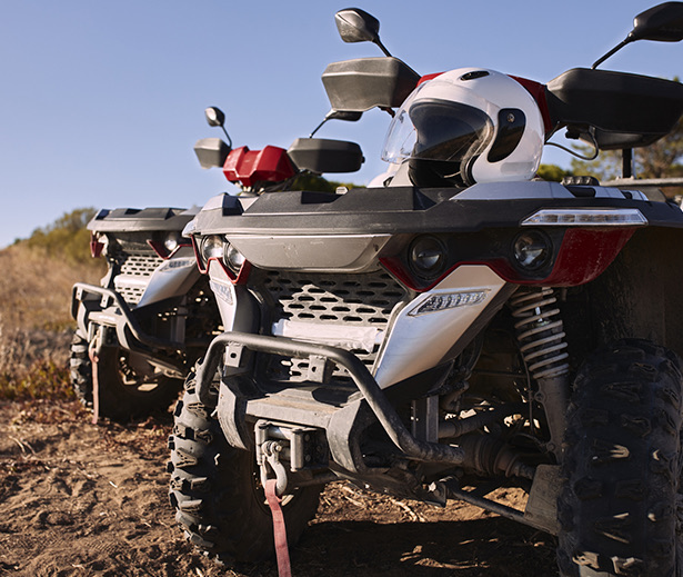 a motorcycle parked on a dirt road