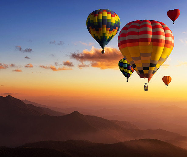 a group of hot air balloons in the sky