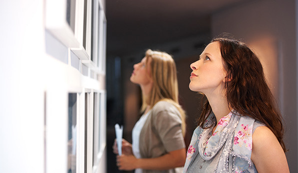 a person looking at another woman