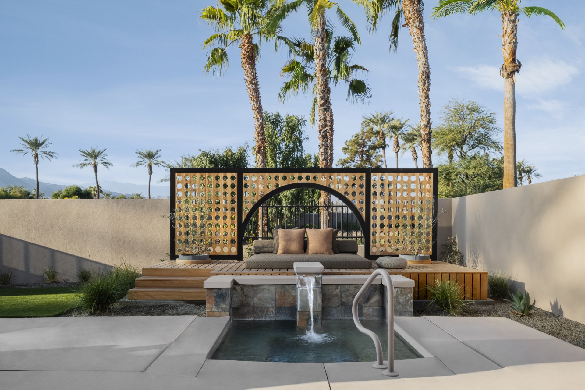 a pool with a pool and a bench with pillows