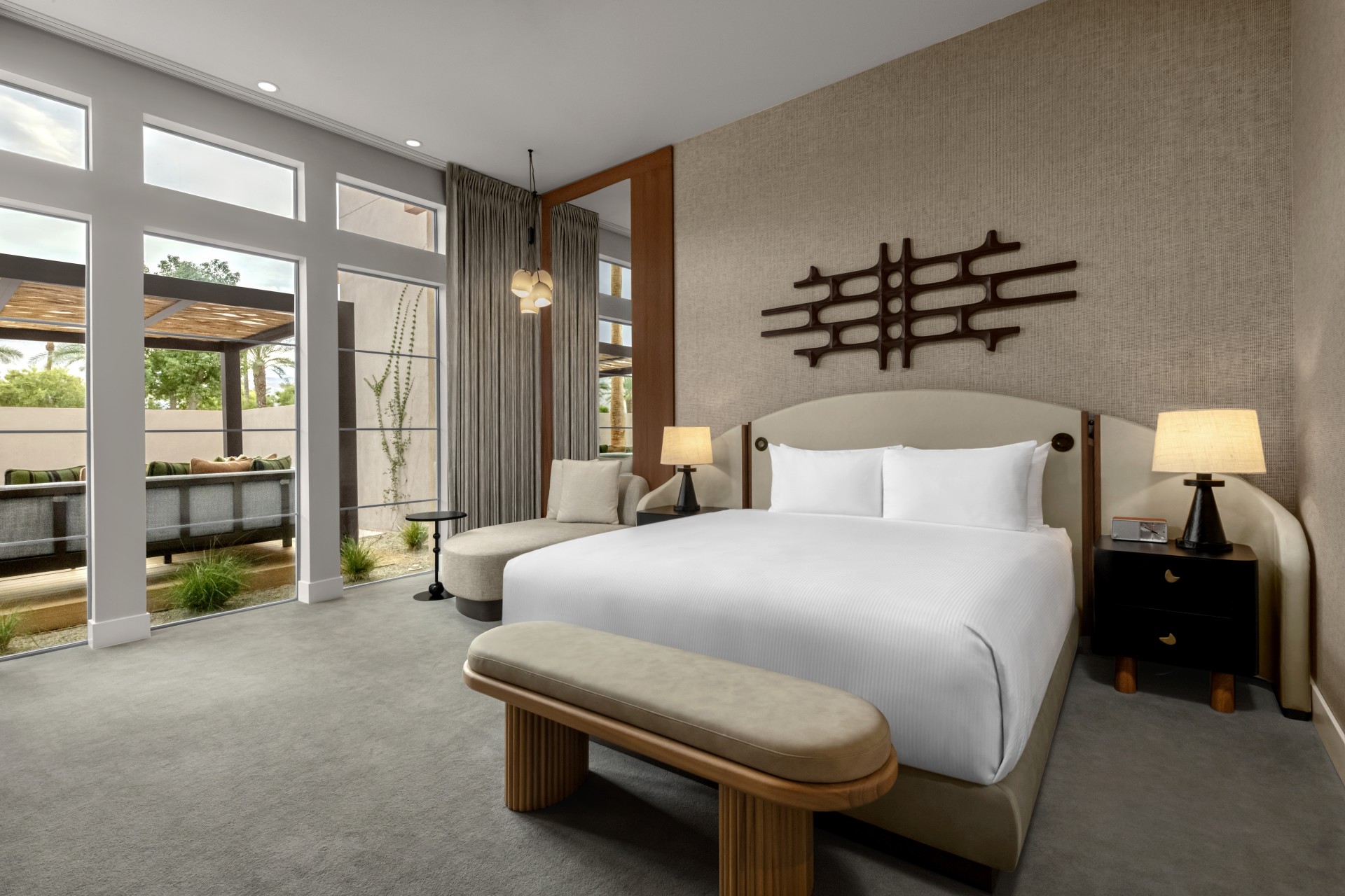 a bedroom with a bed and a bench