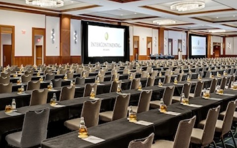 a large conference room with tables and chairs