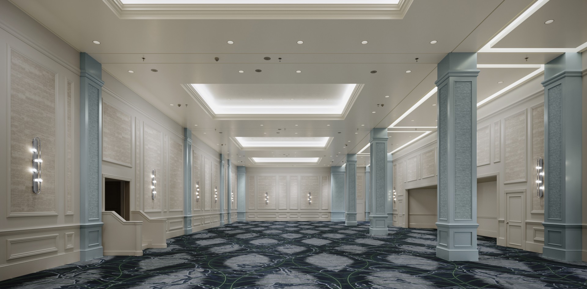 a room with columns and a blue carpet