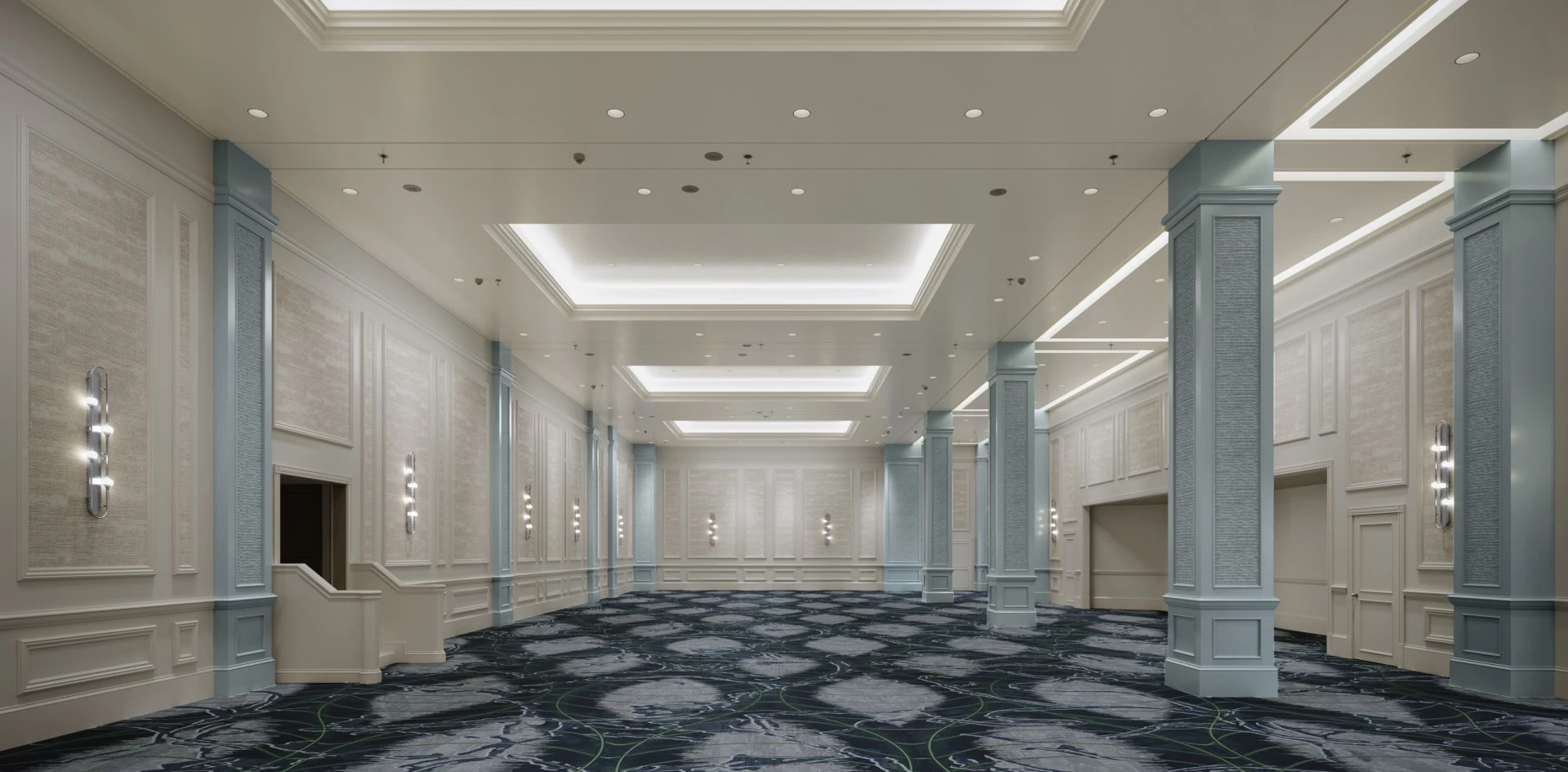 a room with columns and a blue carpet