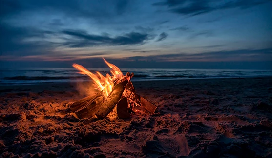 a bonfire on a beach