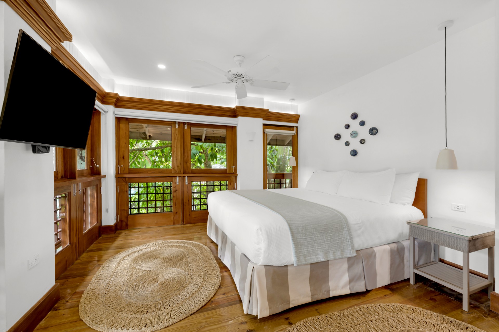a bedroom with a large bed and a rug
