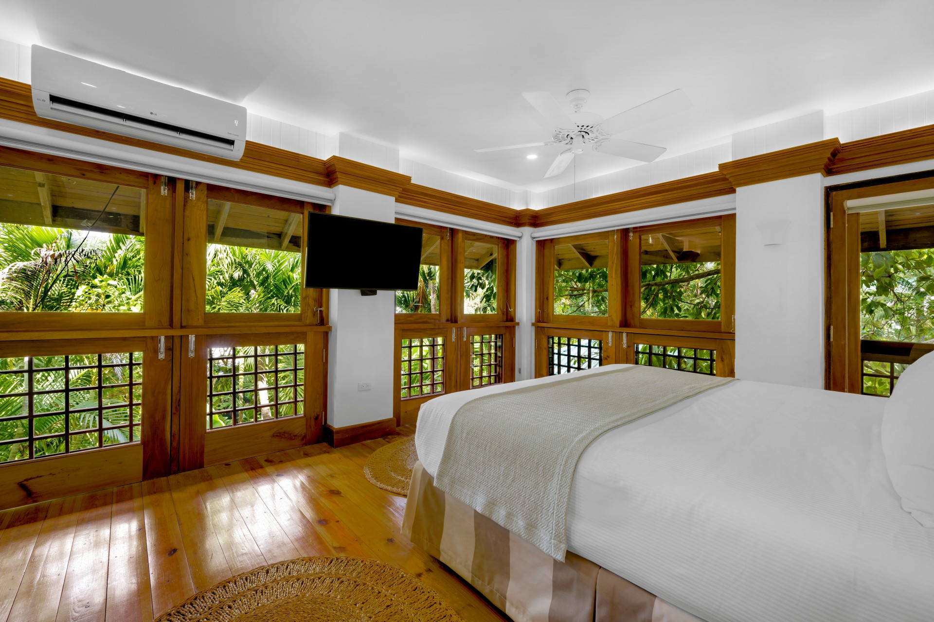 a bedroom with a large bed and a television