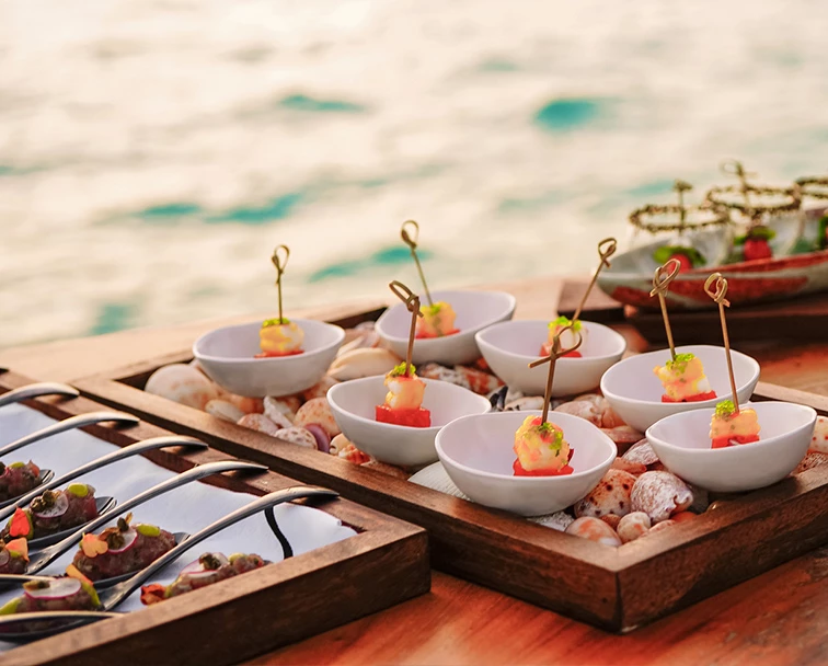A variety of appetizers on oak table.