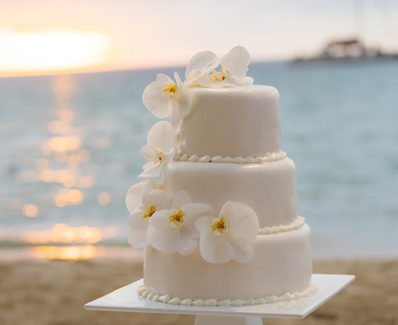 a white cake with flowers on top