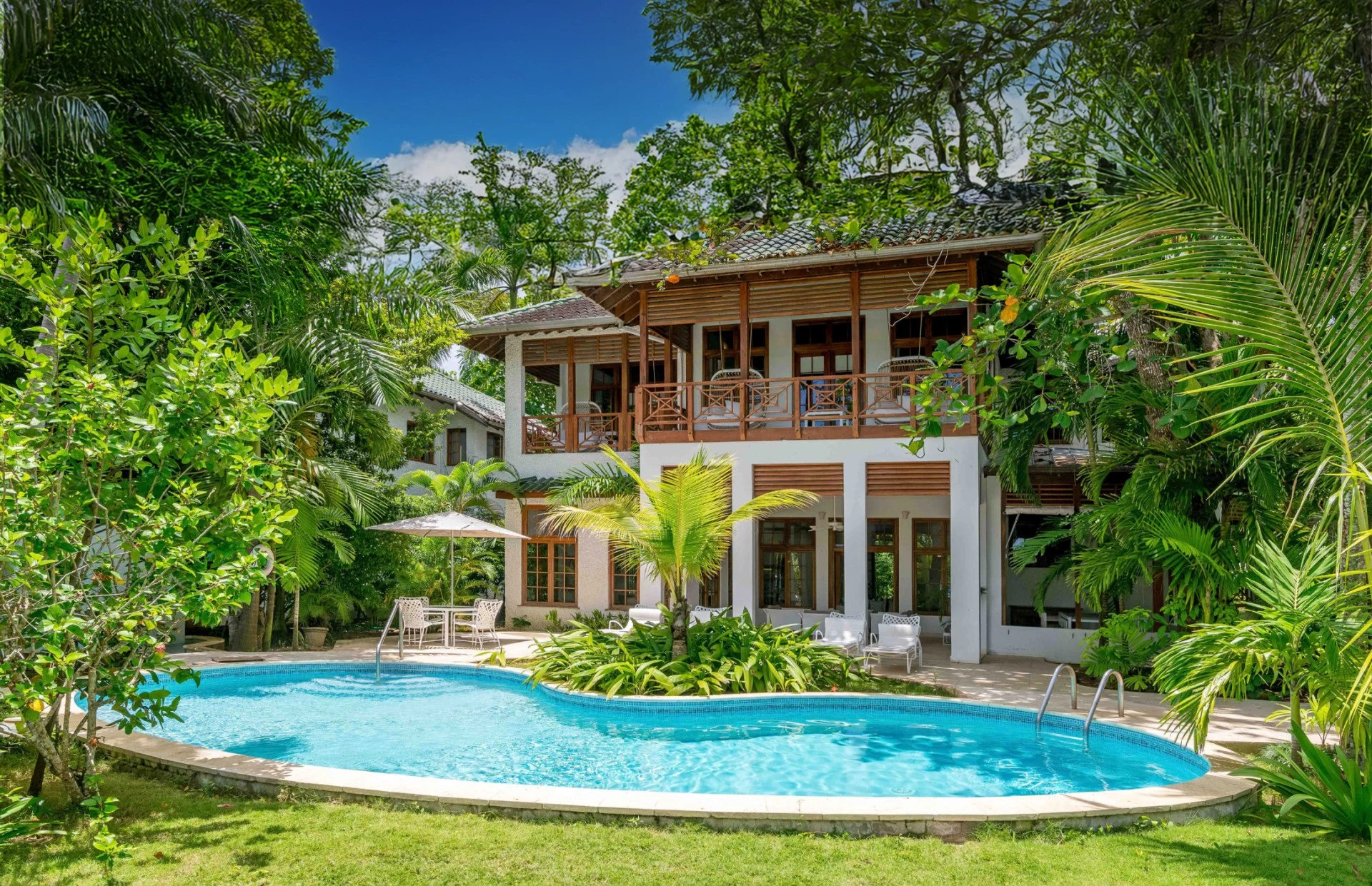 a pool in front of a house