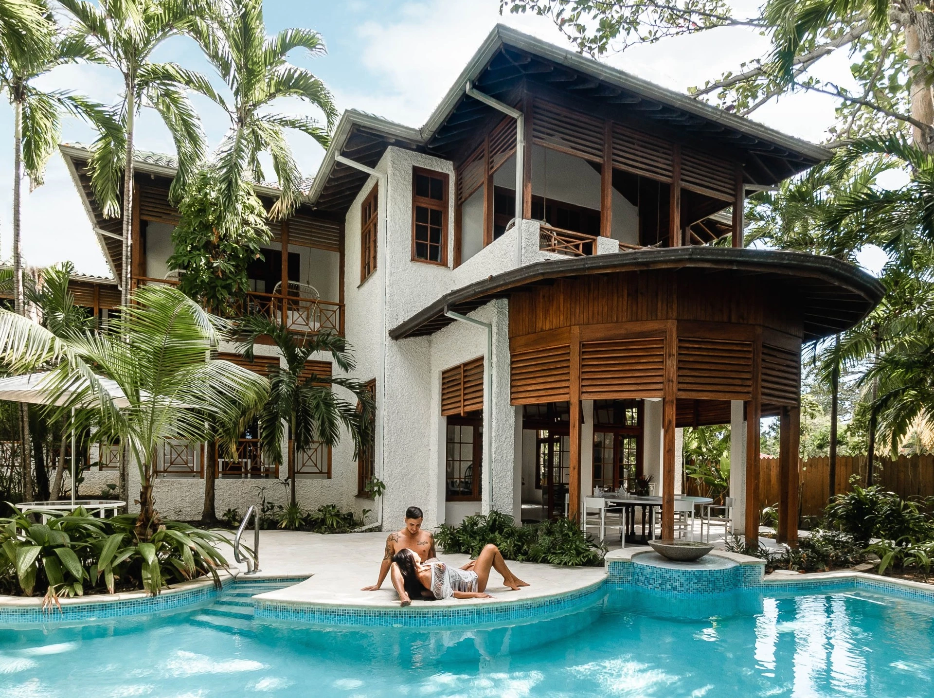 two people sitting in a pool of water