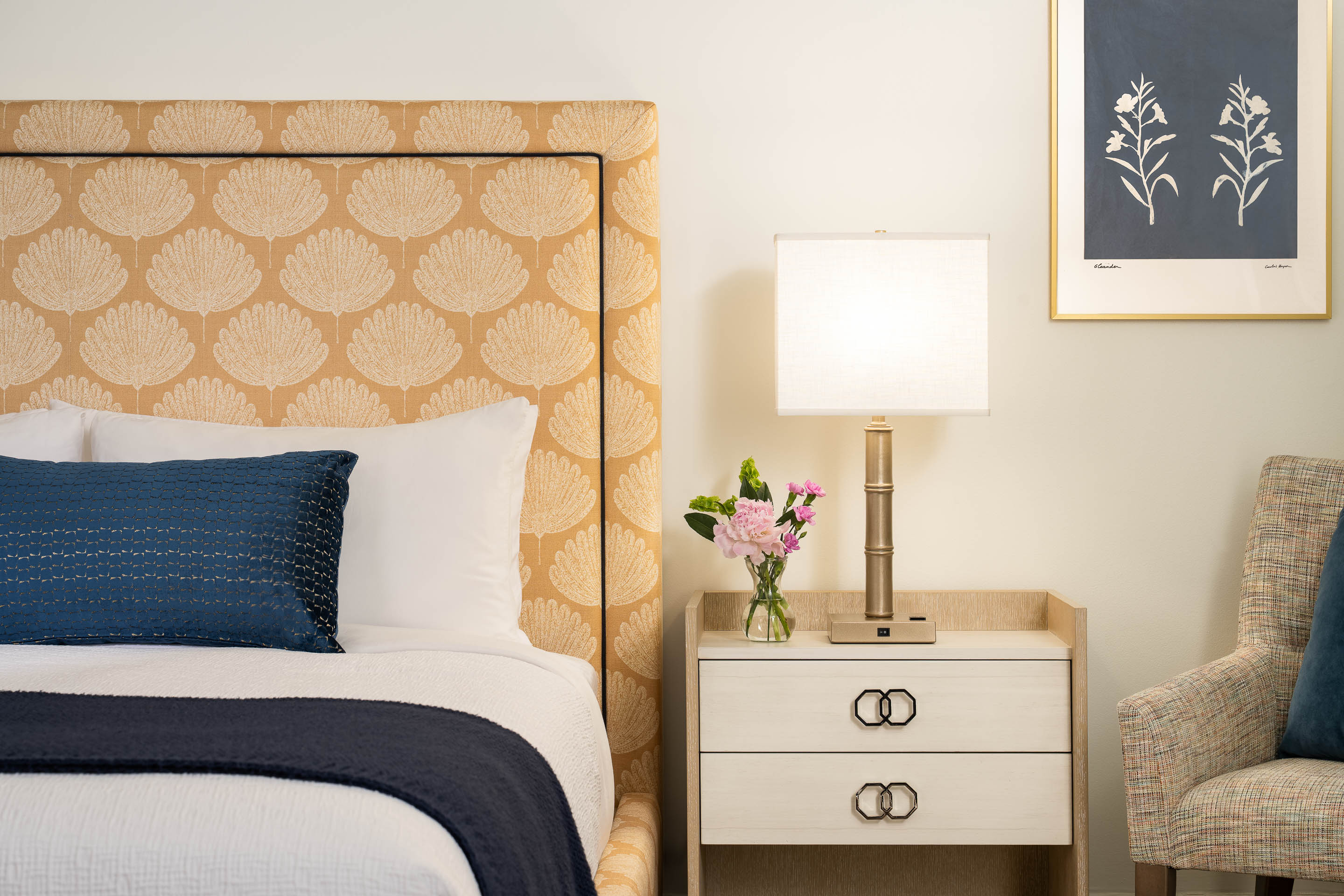 a bed with a lamp and a table