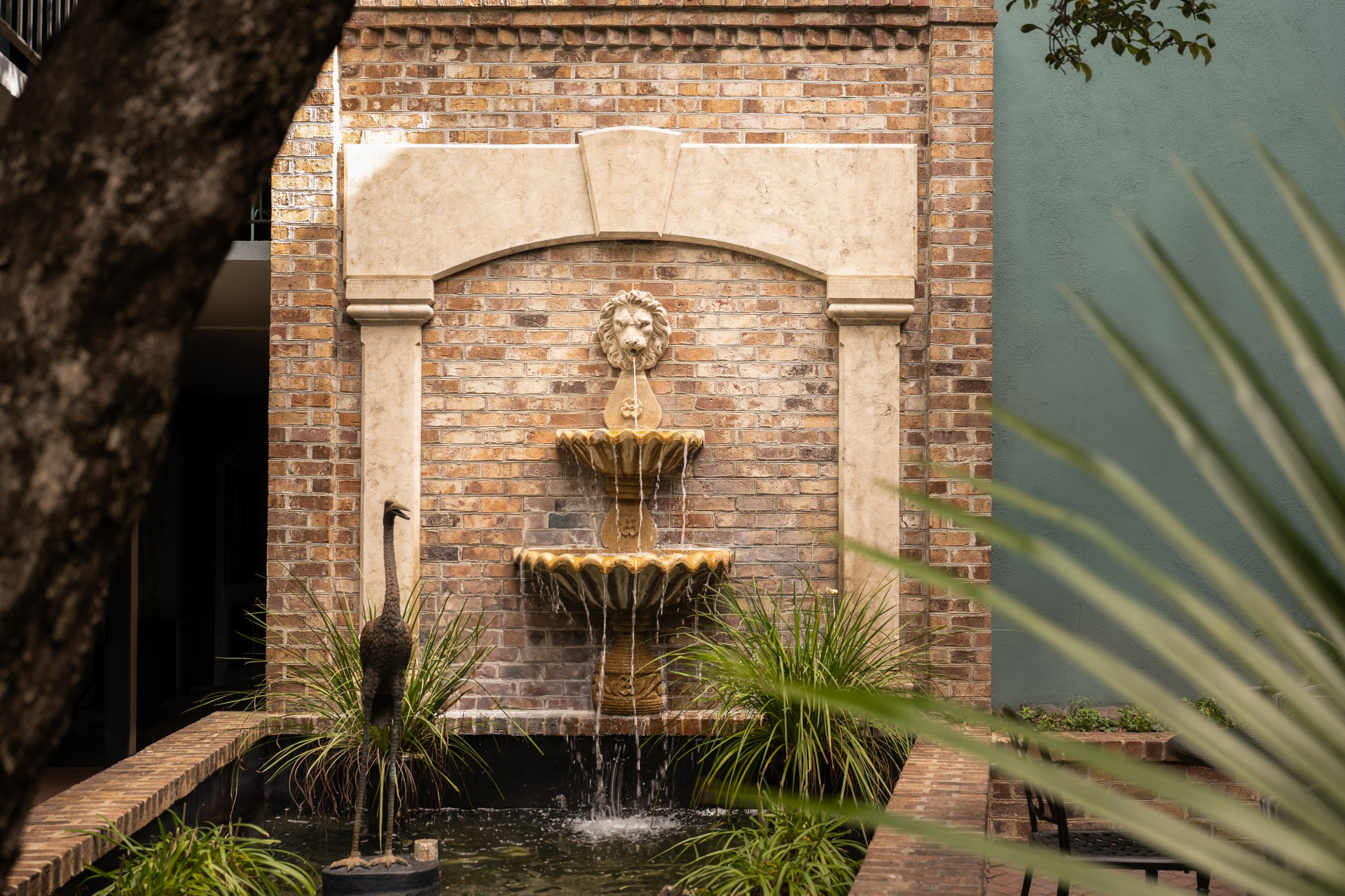 a fountain in a brick wall