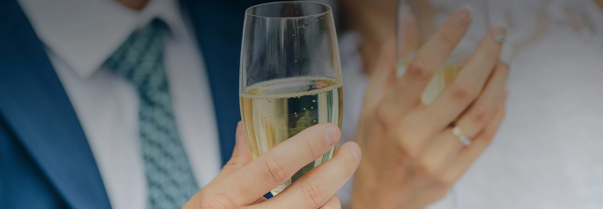 a man holding a glass of wine