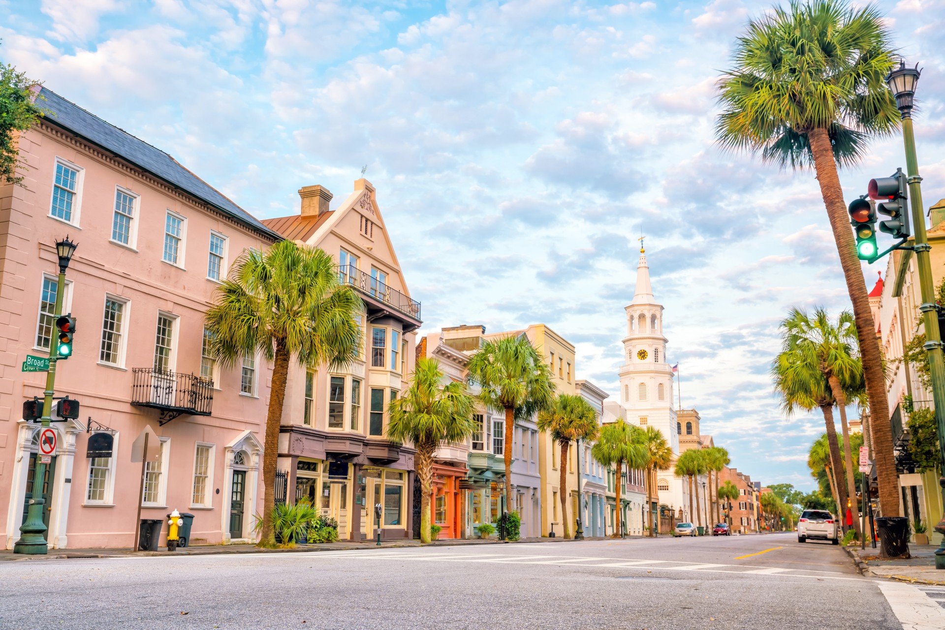 a street with palm trees and buildings