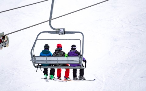 a group of people on a ski lift