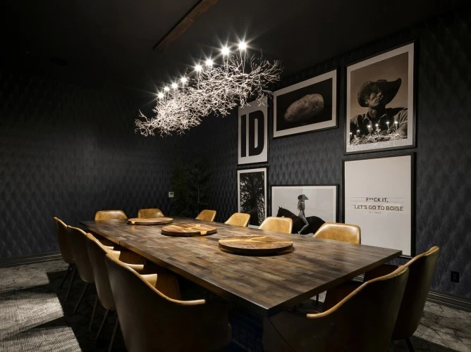 a large table with chairs and a chandelier