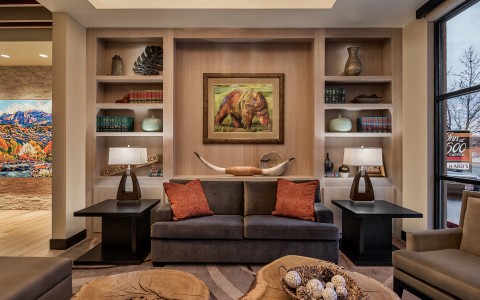 a living room with a couch and shelves