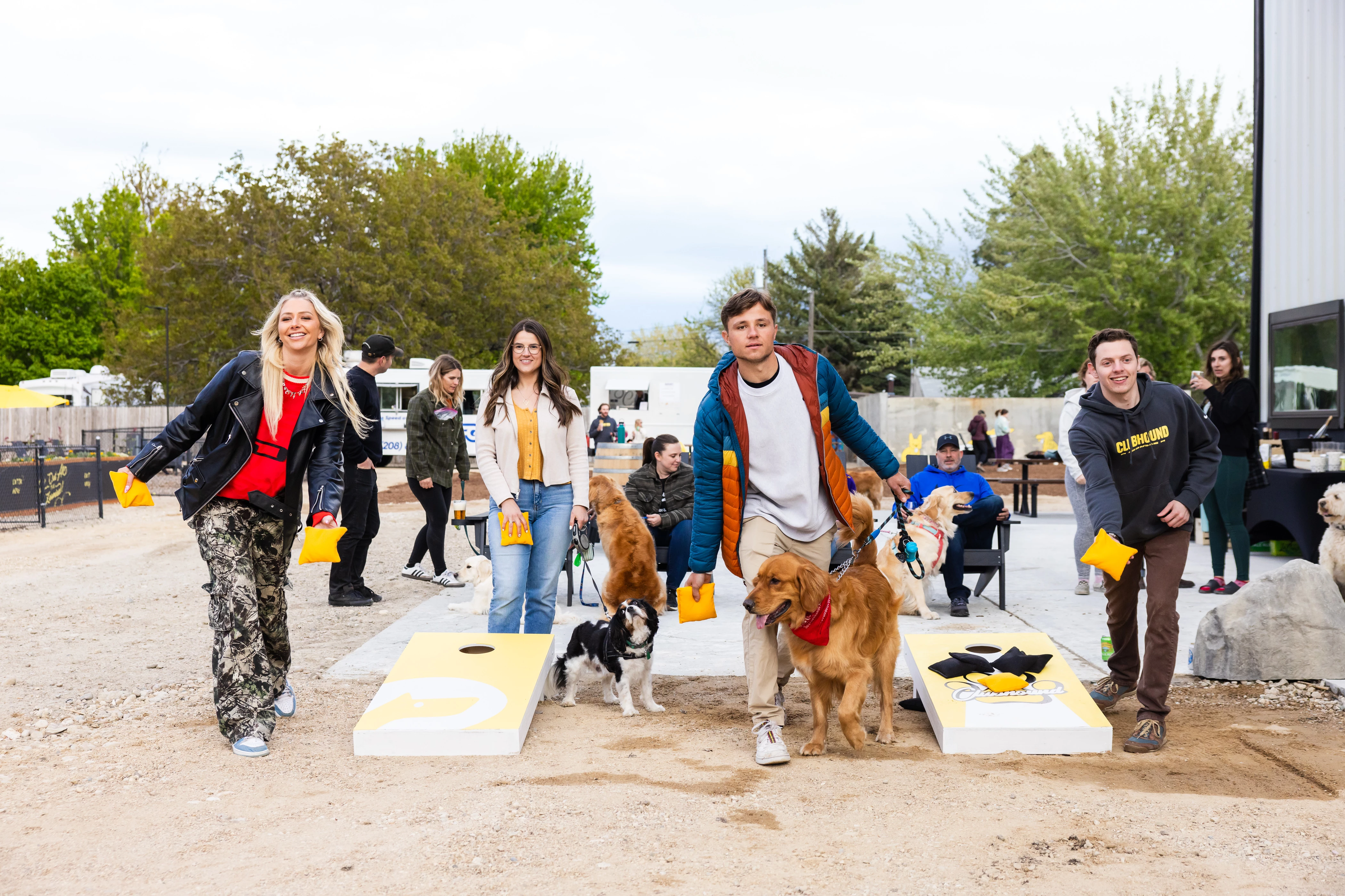 a group of people with dogs