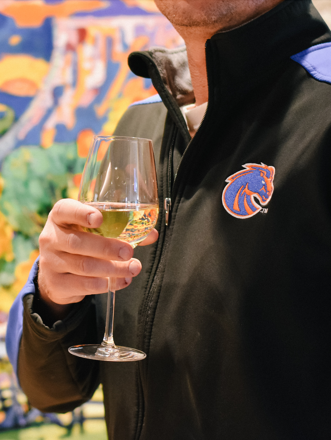 a person holding a wine glass