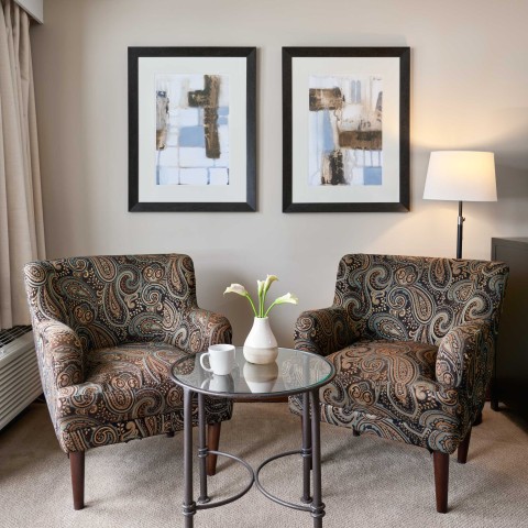 two chairs and a table in a room