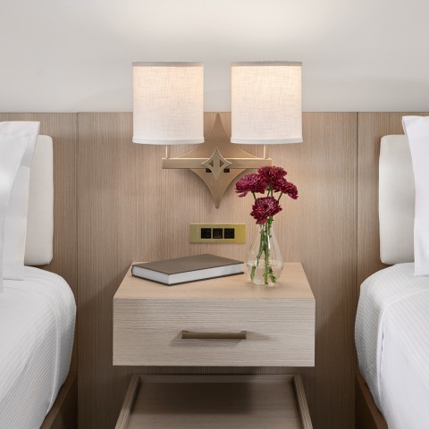 a table with flowers and lamps in a room