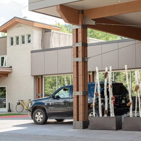 a black truck parked in front of a building