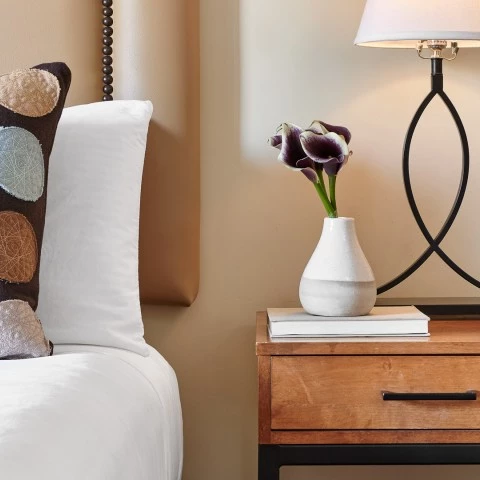 a white bed with a white bed and a white bed with a white bed and a white bed