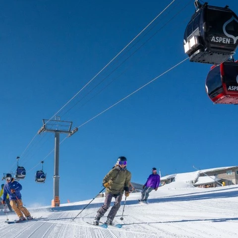 a group of people skiing on a snowy mountain