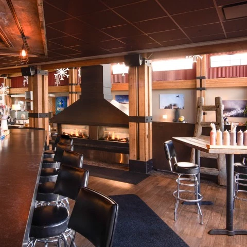 a restaurant with a fireplace