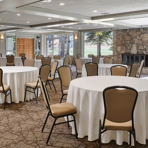 a room with tables and chairs
