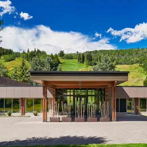 a building with trees in the background