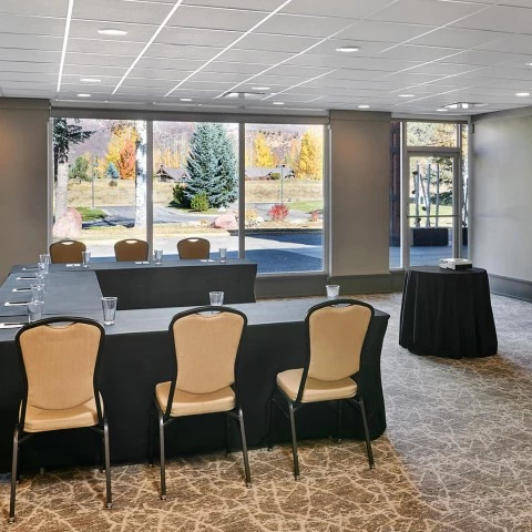 a room with a table and chairs