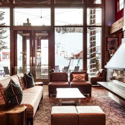 a room with a fireplace and couches