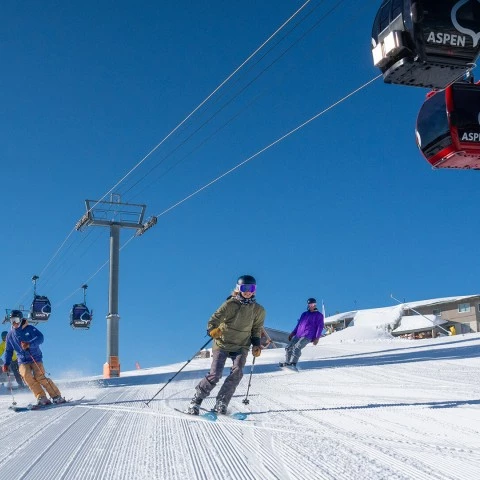a group of people skiing on a snowy mountain