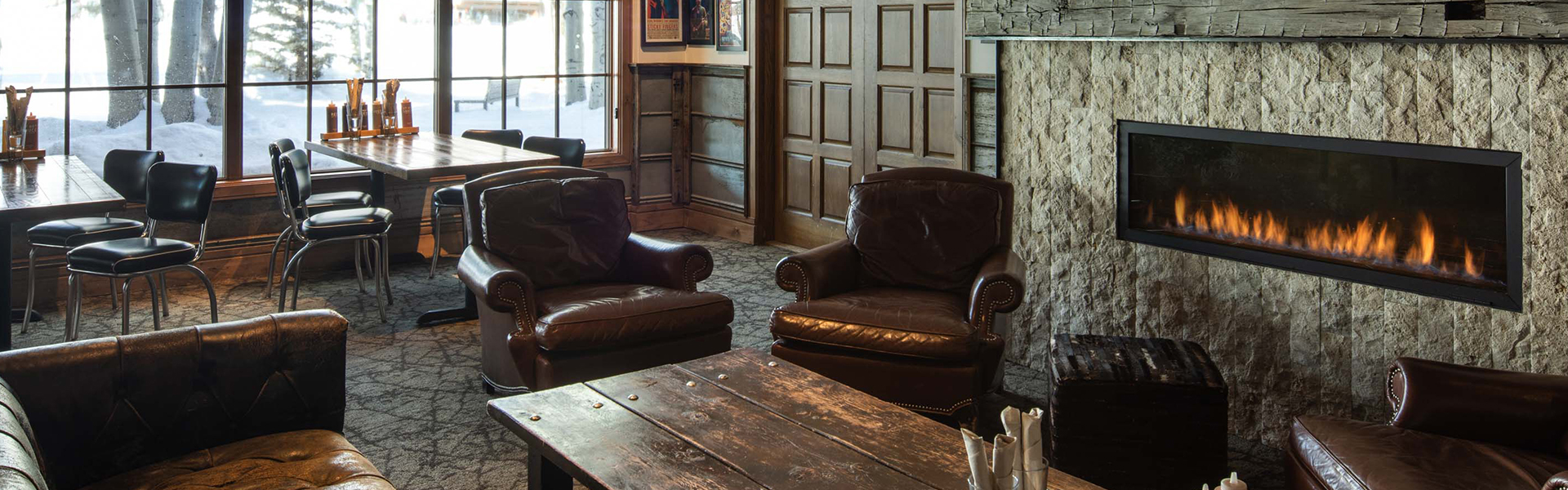 a room with leather chairs and a table