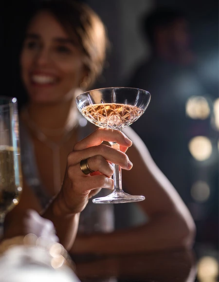 a woman holding a glass of wine