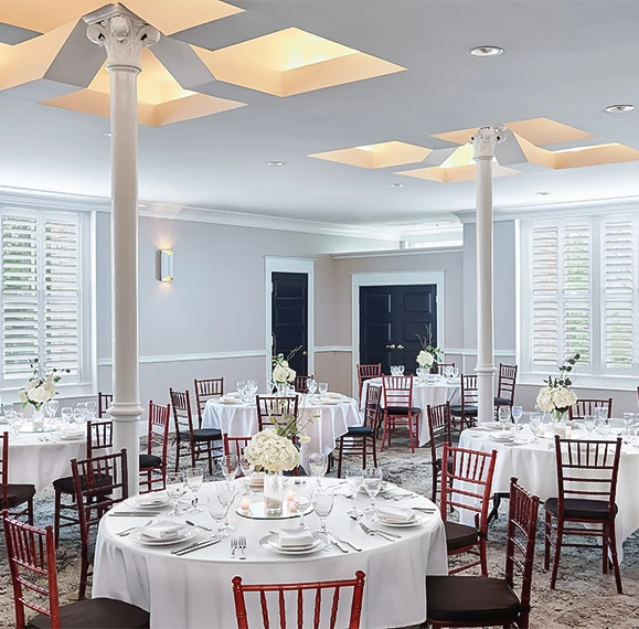 a room with tables and chairs