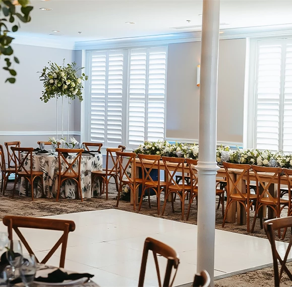 a room with tables and chairs