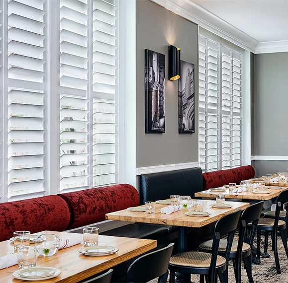 a restaurant with tables and chairs