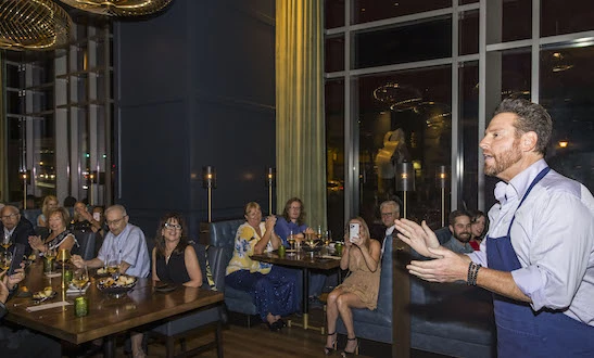 a group of people sitting at tables