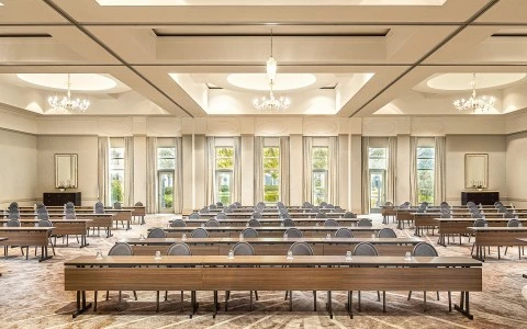 a room with long tables and chairs