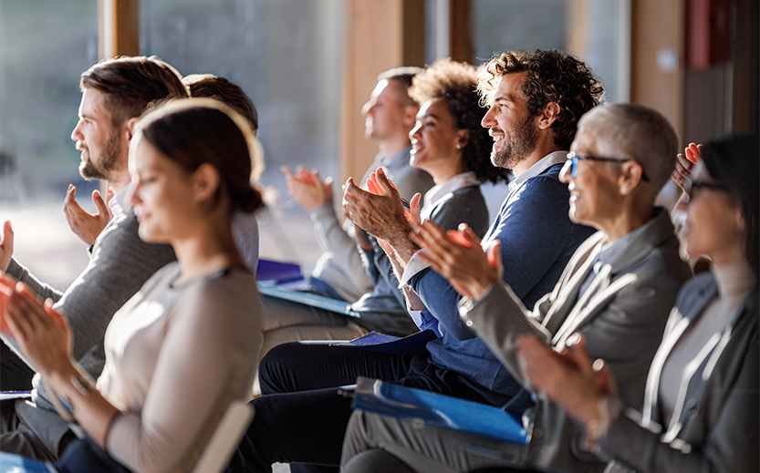 a group of people clapping