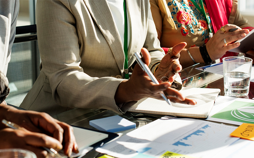 a group of people sitting at a table