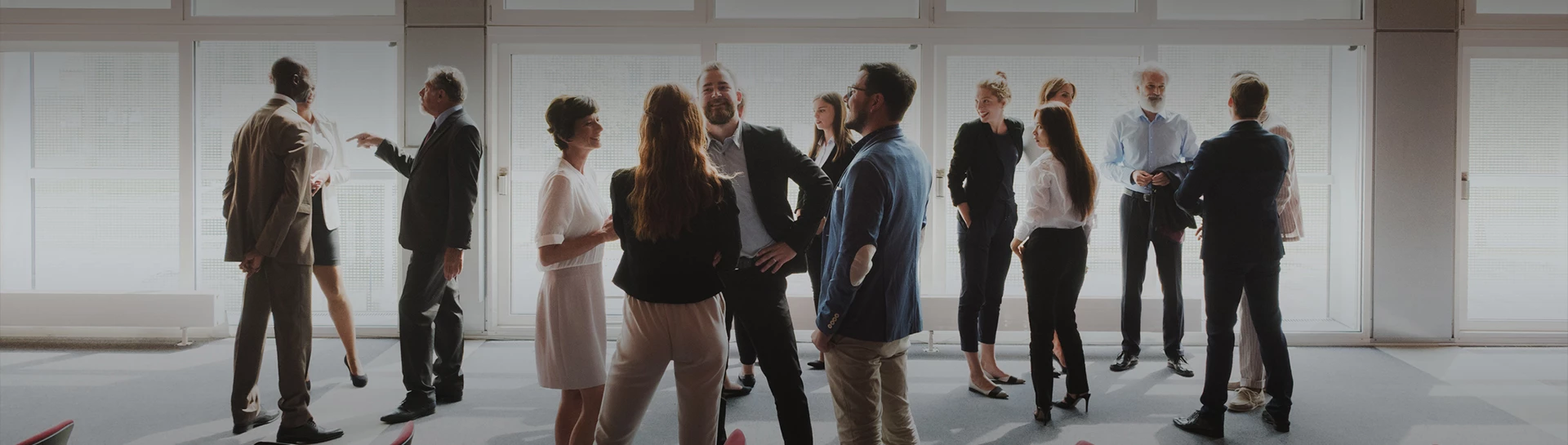 a group of people standing in a room