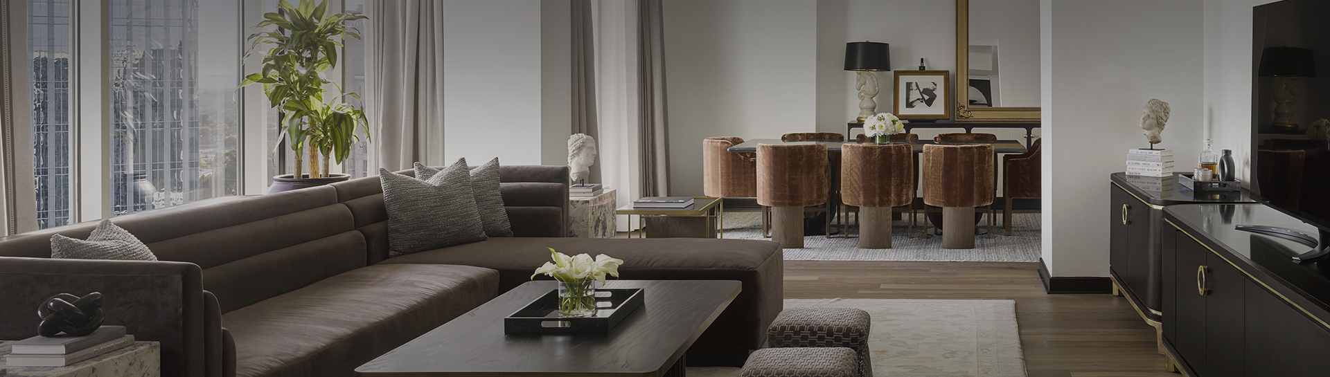 a living room with a table and chairs