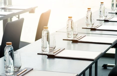a table with empty glasses and bottles on it