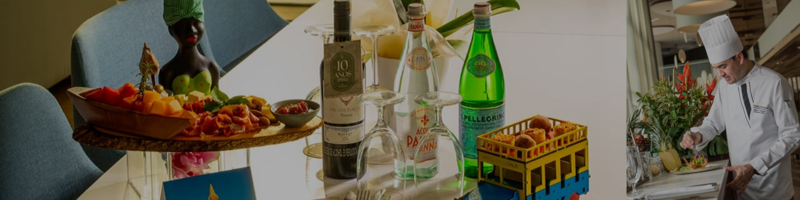 a table with wine glasses and bottles